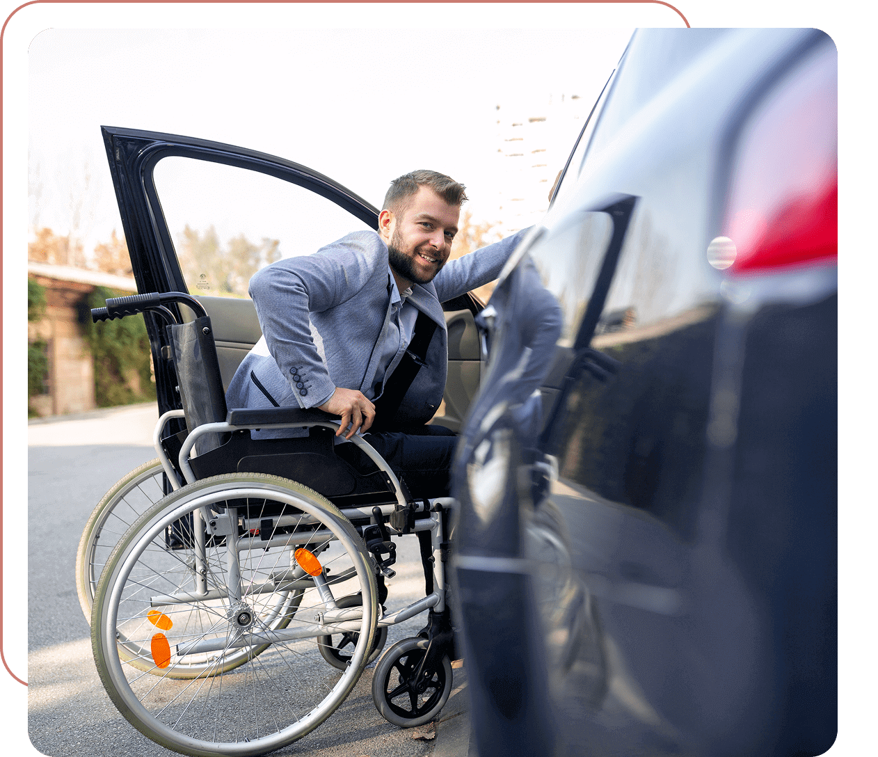 Man in wheelchair entering car.