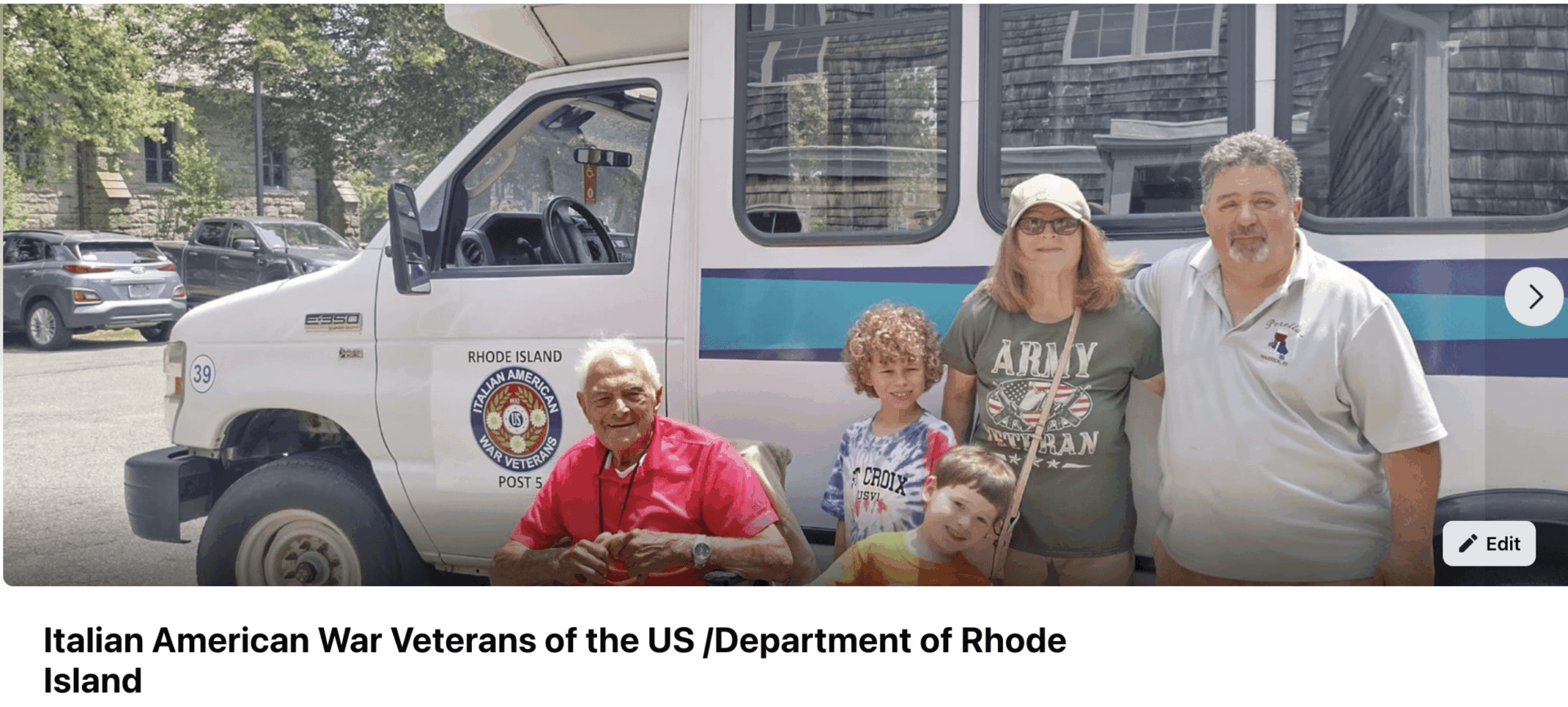 Group posing in front of a van.